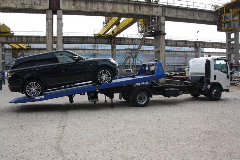 Isuzu эвакуатор со сдвижной платформой