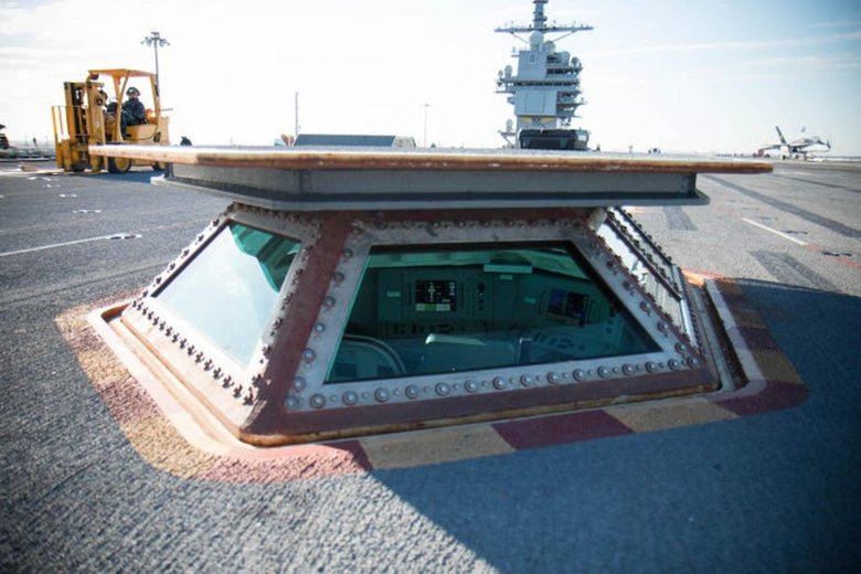 Life inside the smallest room on dangerous flight deck of an aircraft carrier