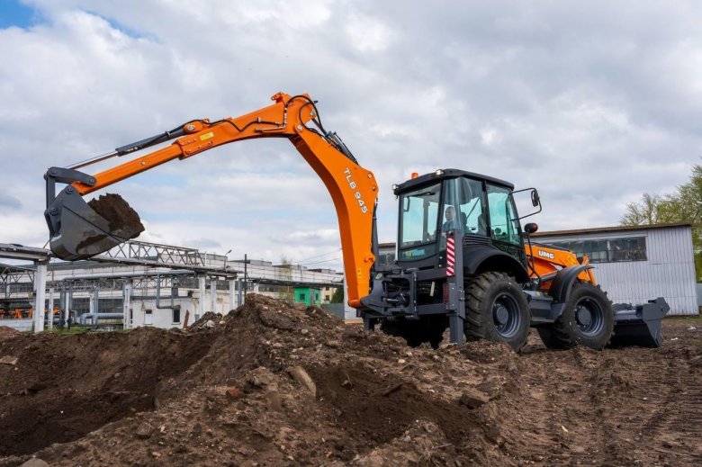 Фронтальный погрузчик экскаватор