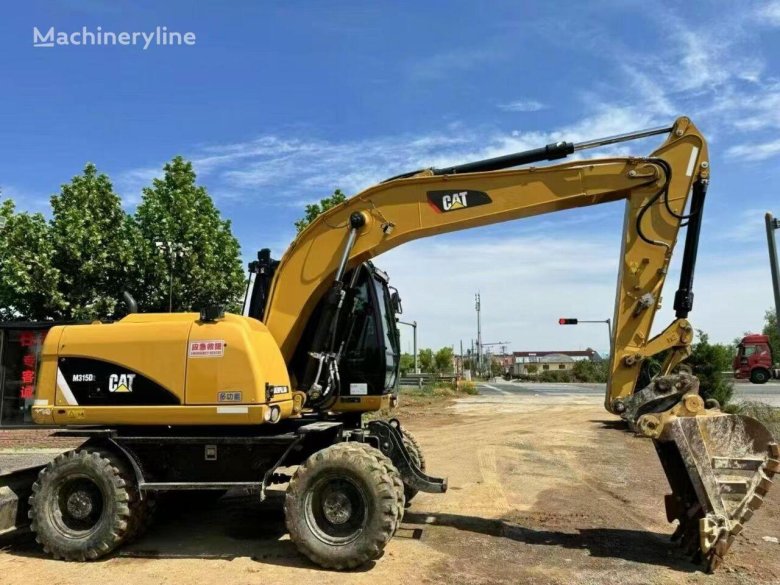 Экскаватор полноповоротный колесный катерпиллер