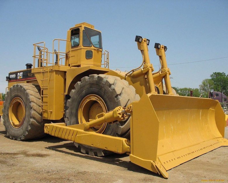 Колесный бульдозер катерпиллер