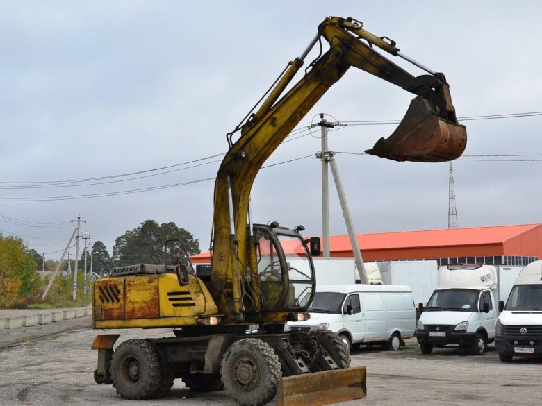 Колесный экскаватор твэкс ек12