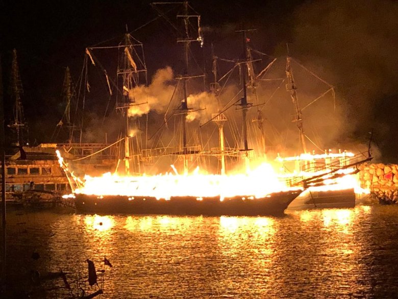 Ship on fire at night