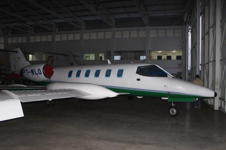 Girl sitting on Learjet 25